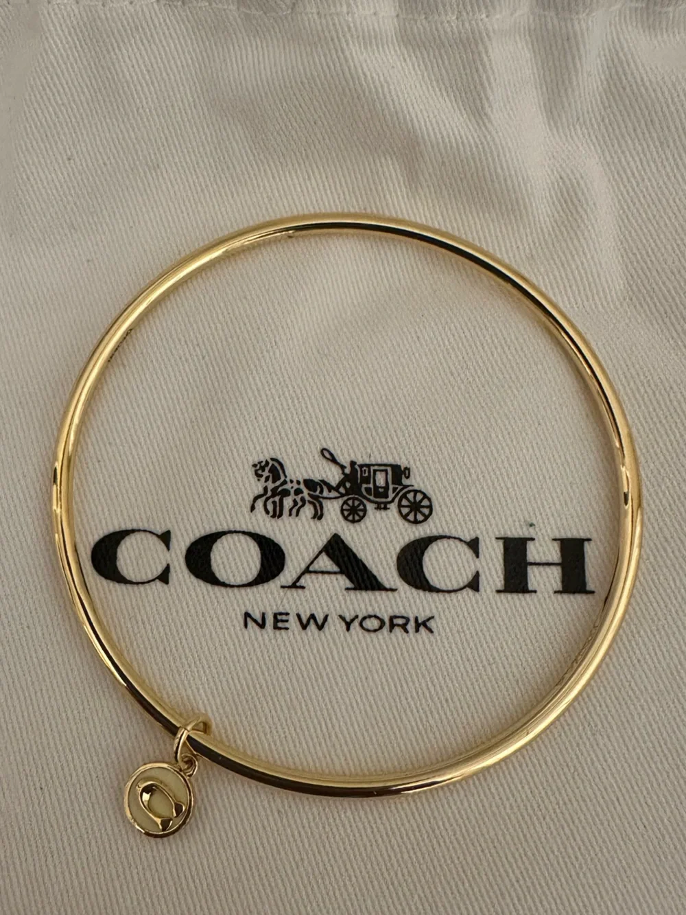 Coach Gold-tone Round Bangle with Signature Charm